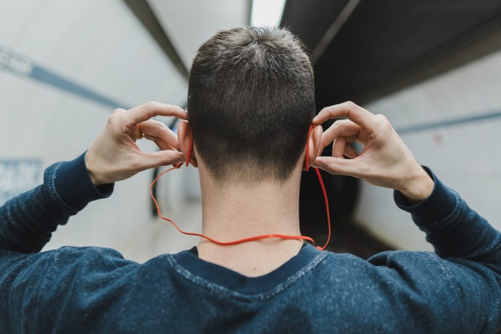 Anonymous man with earplugs